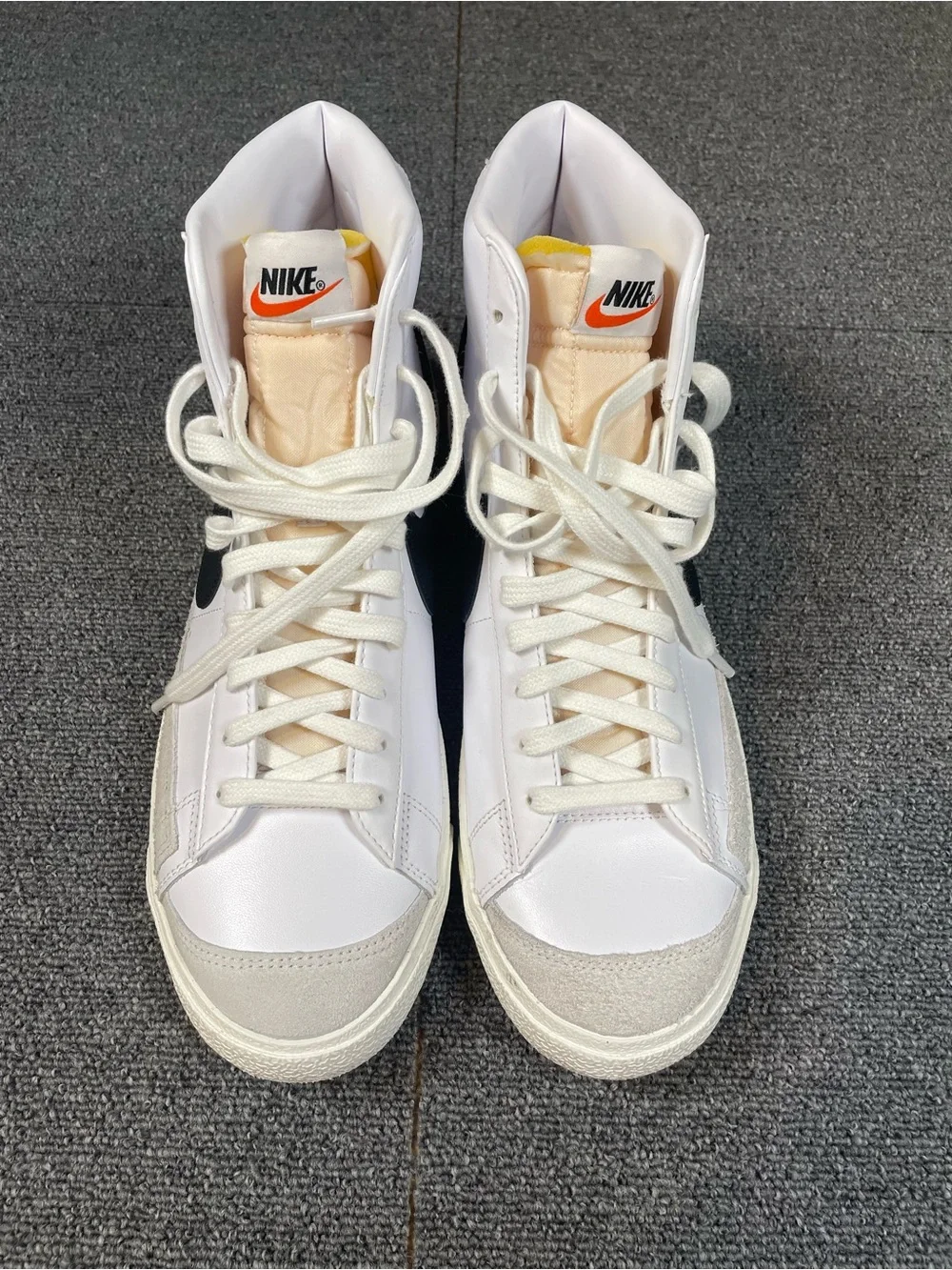 Men’s Nike White High-Top Sneakers with Black Swoosh
